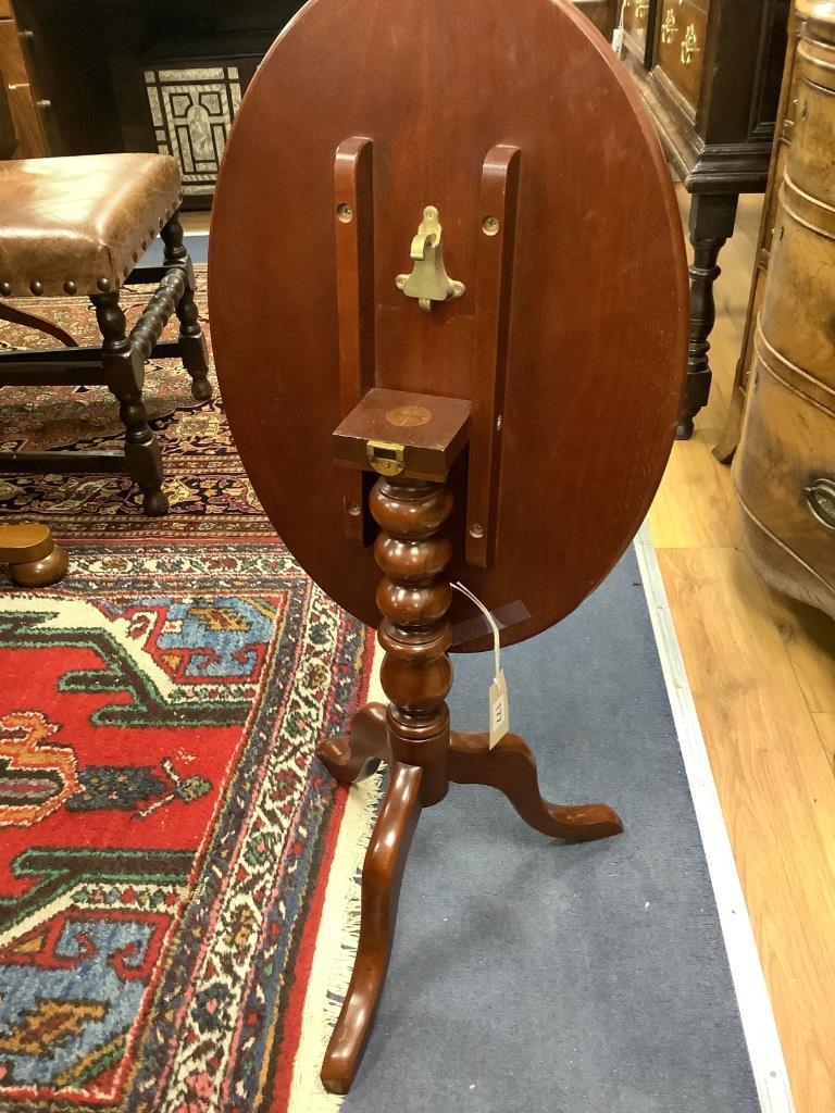 A Victorian oval mahogany occasional table, on pedestal support, width 55cm depth 39cm height 56cm